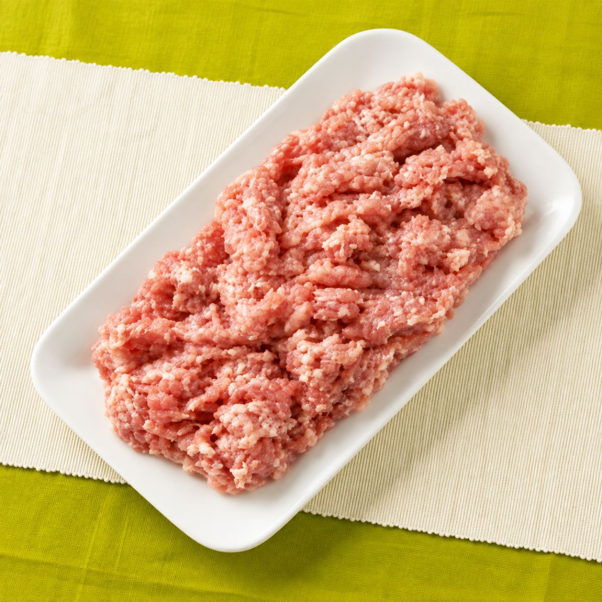Fresh halal chicken mince (keema) served on a white dish.
