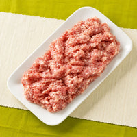 Fresh halal chicken mince (keema) served on a white dish.